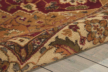 Close-up of the gold Nourison Paramount Persian rug showing its intricate floral pattern and soft texture.