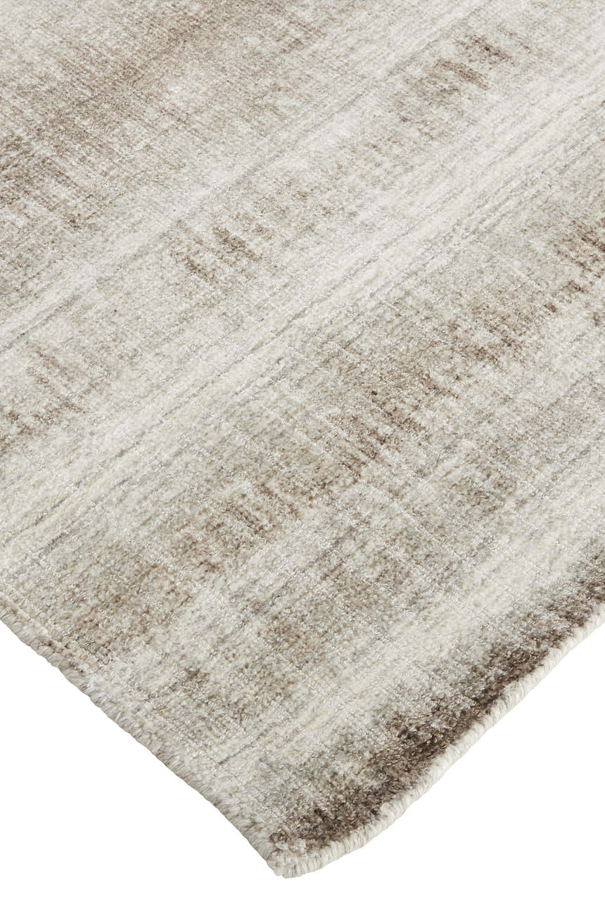 Close up of Feizy Mackay Transitional Stripes Area Rug in tan, ivory, and brown with hand woven texture. Corner