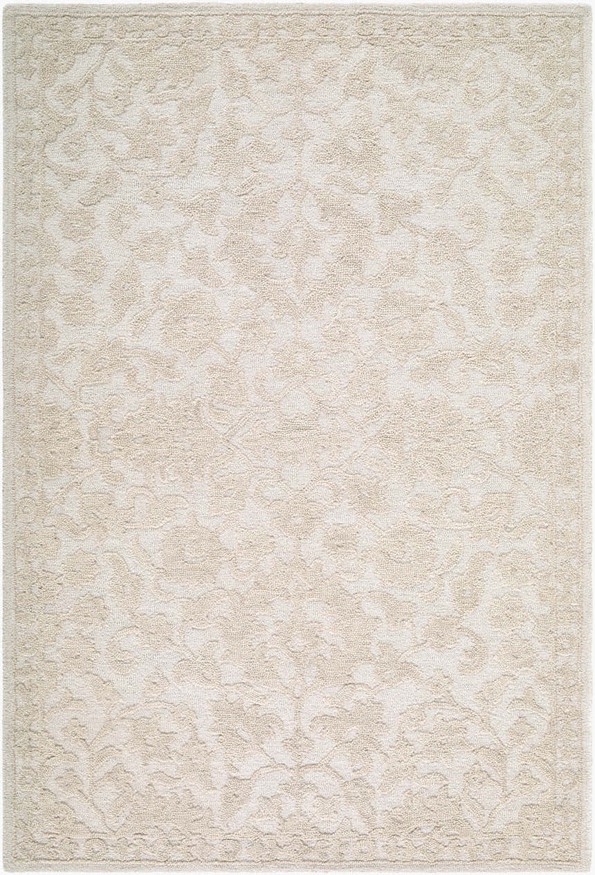 Close-up of the Eligia Hybapi rug. Hand-tufted wool rug in ecru, ivory, and sandstone with a traditional floral pattern. Design-Rectangle-576