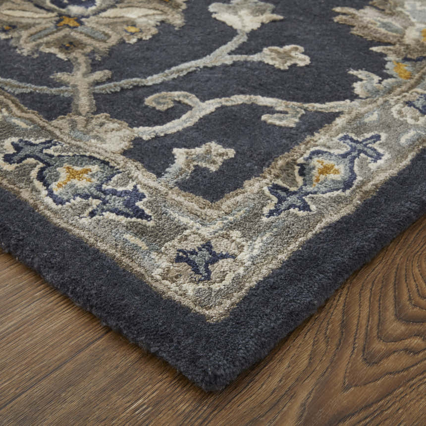 Close up of the Feizy Prescott rug. Blue, gray, and silver floral pattern on a hand-tufted wool rug. Corner