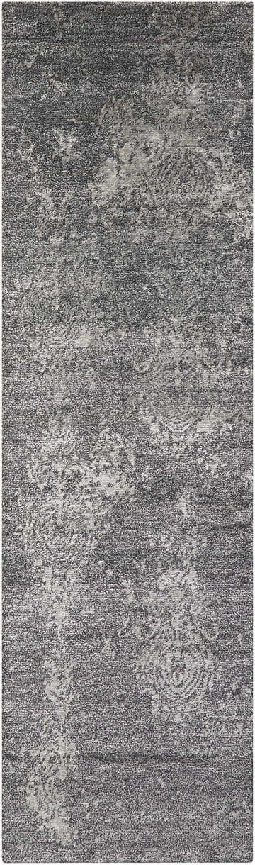 Close-up of the Nourison Silk Shadows Graphite Vintage Area Rug, featuring a distressed pattern and soft texture.