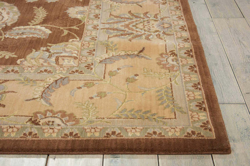 Close-up of the chocolate Nourison Persian Empire rug. Features a floral Persian design, brown border, and soft texture.