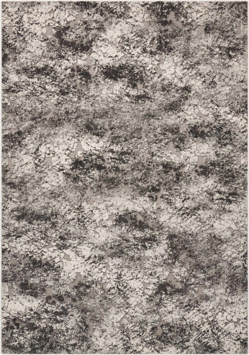 Close-up of the Michael Amini Gleam Ash area rug, showcasing its abstract, mottled pattern in shades of ash, black, and gray.