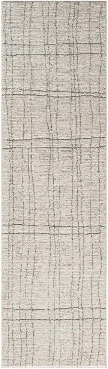 Close-up of the Nourison Andes Ivory Grey rug. High pile rug with a Scandinavian design and chestnut-colored lines.