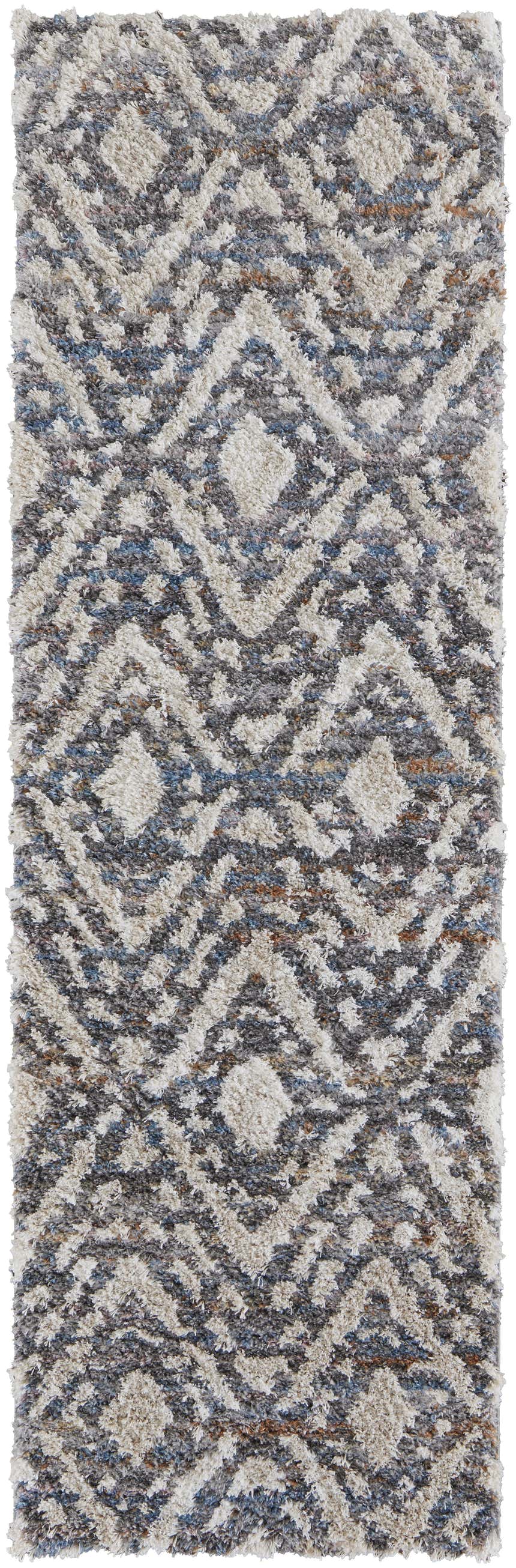 Close-up of Feizy Mynka Transitional Diamond rug. Ivory, gray, and taupe shag rug with a diamond pattern. Soft, textured design. Design-Runner
