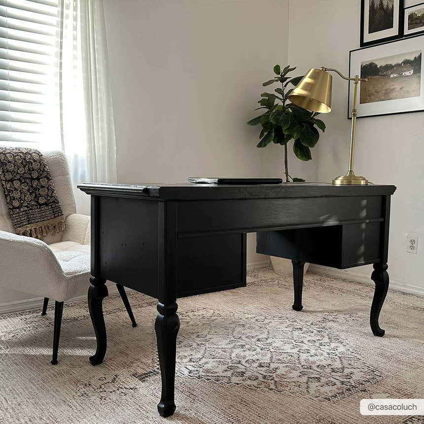 Home office with black desk on Becki Owens x LIVABLISS Lila rug. Farmhouse style with off-white, brown, and red tones. Roomscene-Rectangle