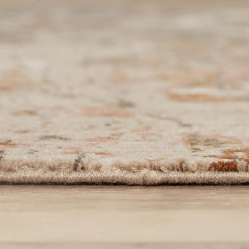 Close-up of Rizzy LOG734 area rug showing beige, rust, and dark red abstract pattern and machine woven texture. Pile