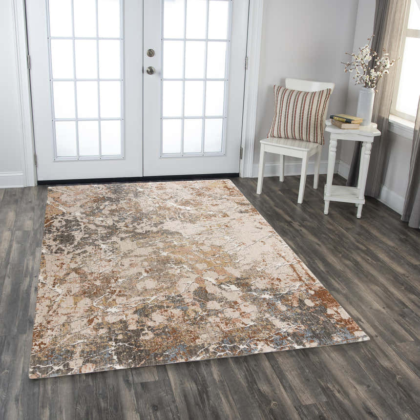 Entryway scene with Rizzy LOG734 rug. Abstract design in beige, dark red, and rust on dark wood floors. White door and accents. Roomscene-Rectangle