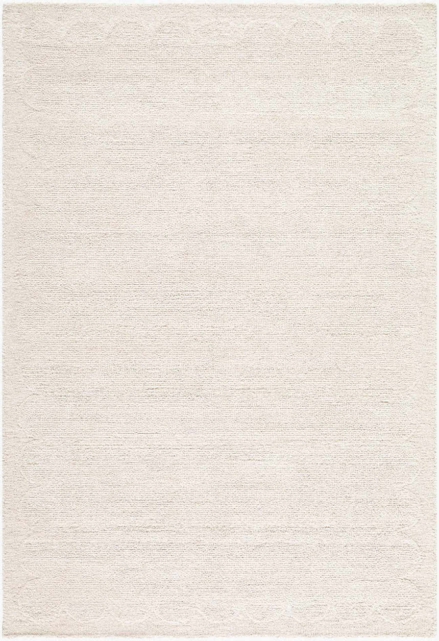 Close-up of a hand-tufted Kazuto Area Rug. The rug is cream and ivory wool with a subtle geometric pattern. Design-Rectangle