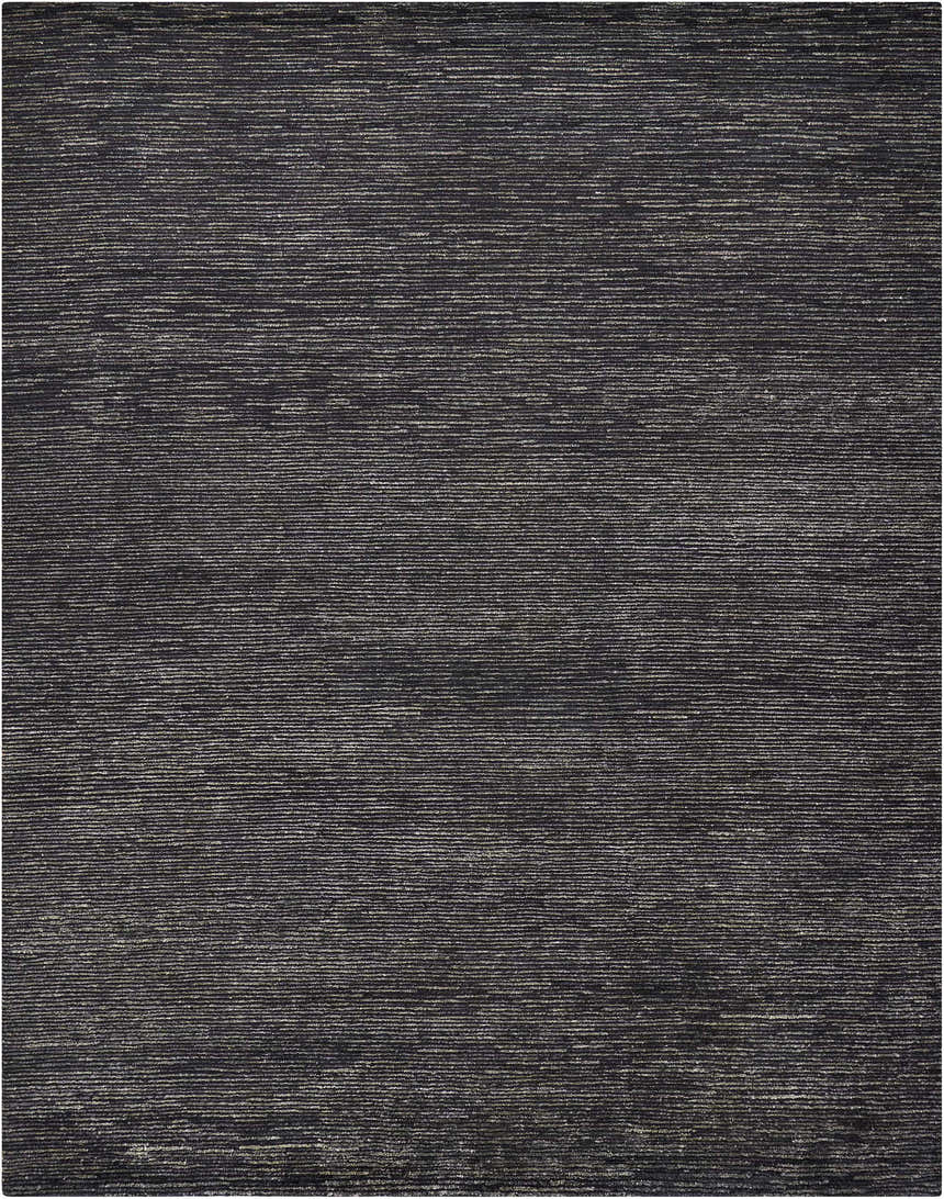 Close-up of the Nourison OCEAN Onyx Rug. Black rug with subtle, horizontal striations. Handmade, mid-century modern style.