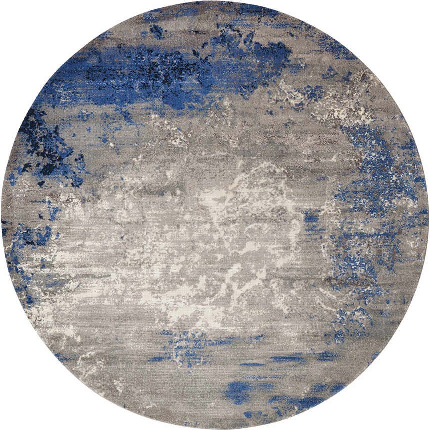 Close-up of round Nourison Twilight Blue Grey rug. Modern design with blue and gray abstract pattern.