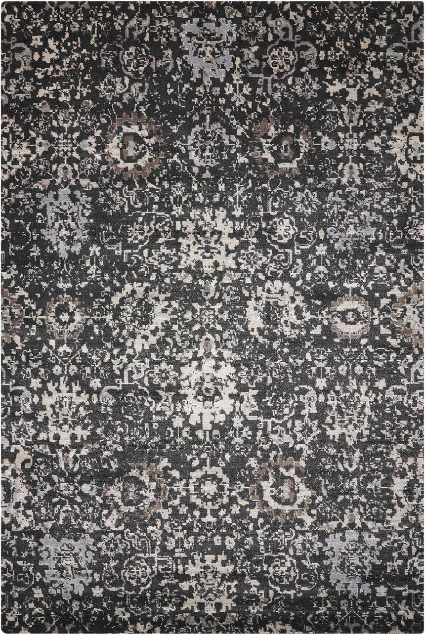 Close-up of the Nourison Twilight Onyx Persian rug. Black rug with distressed, intricate patterns in gray, beige, and brown tones.