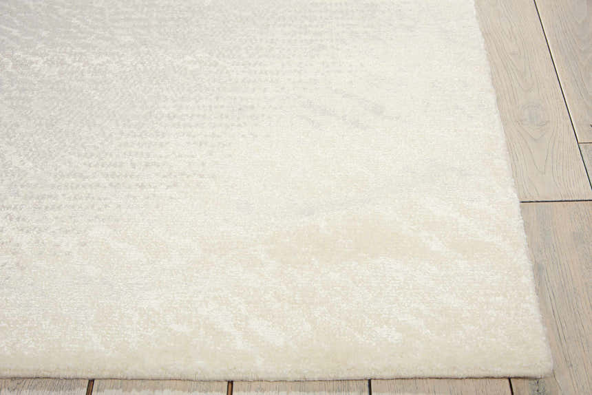 Close-up of the ivory and grey Nourison Twilight rug showing its texture and subtle modern pattern.
