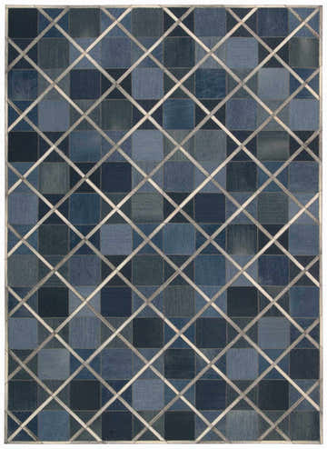 Close-up of the Barclay Butera Cooper Indigo rug. Features a patchwork square design with a light geometric overlay.