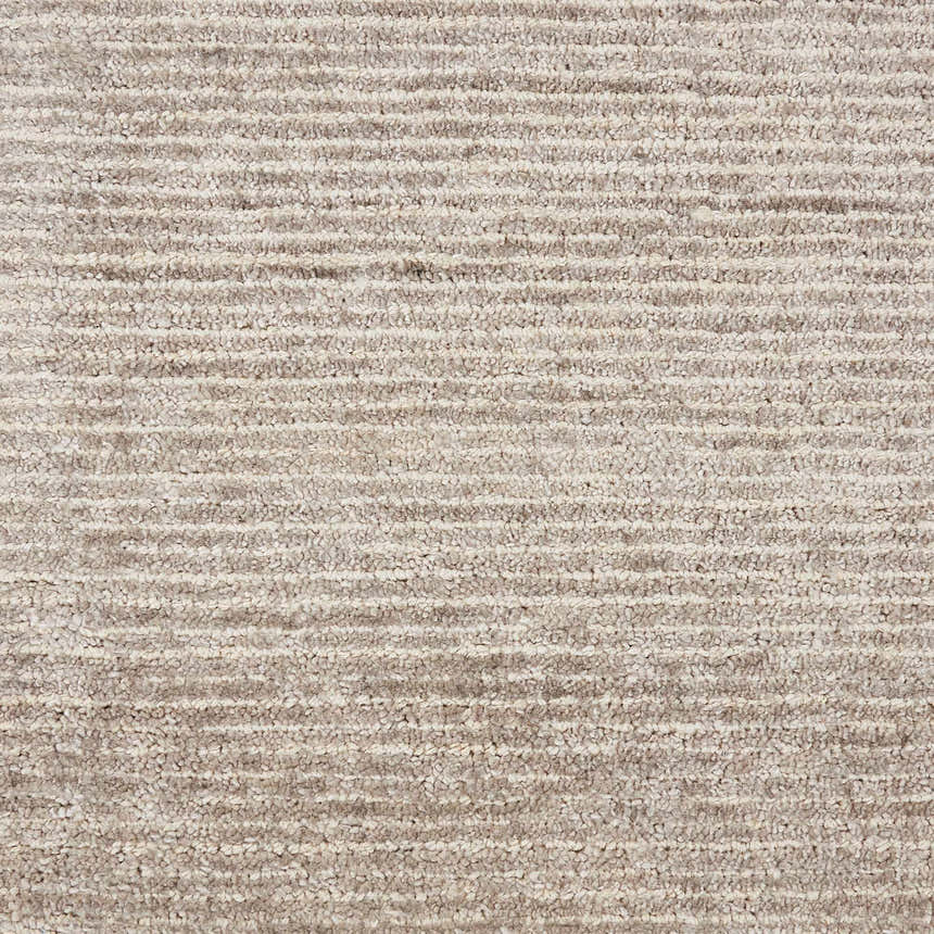 Close-up of the textured Nourison Weston Oatmeal Rug, showing horizontal striations and soft, neutral colors.