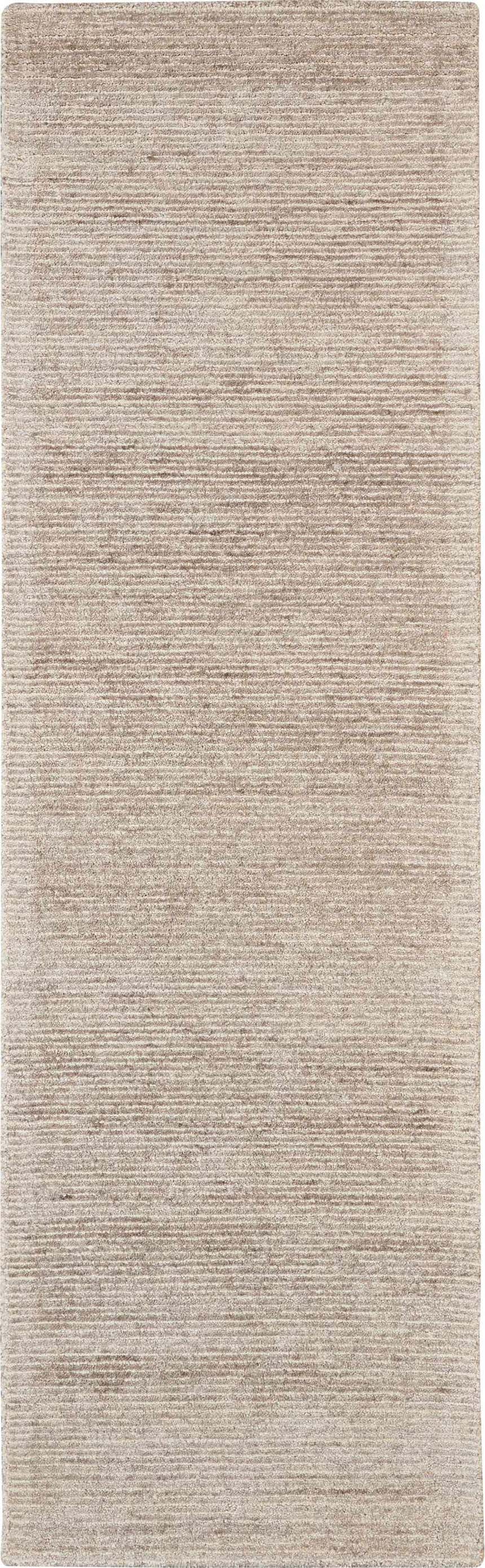 Close-up of the Nourison Weston Oatmeal rug. Modern design with subtle horizontal lines and soft, neutral color.