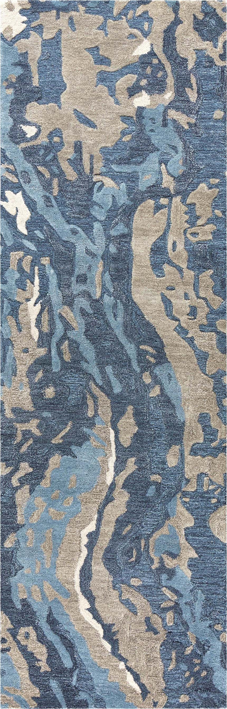 Close-up of the Rizzy MO867A area rug. Contemporary design in beige, gray, navy, and taupe. Hand-tufted wool rug texture. Design-Runner
