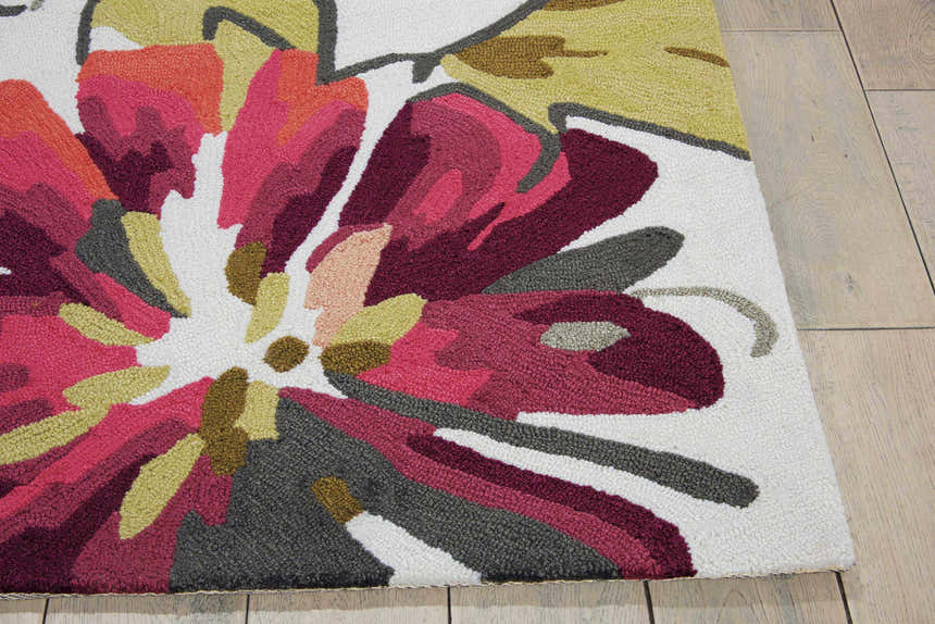 Close-up of the Nourison Fantasy Ivory rug, featuring a large floral design in chestnut, pink, and gray hues.