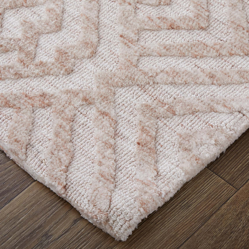 Close-up of the Feizy Colton Modern Diamond Pink/Ivory Area Rug showing the diamond pattern and plush texture. Corner