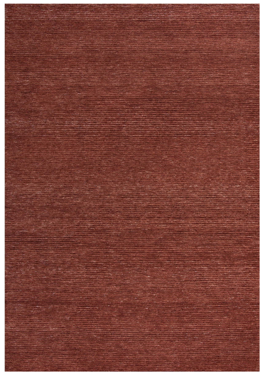 Close-up of the hand-tufted Rizzy MPK101 area rug in dark red and rust, showing its casual, solid texture. Design-Rectangle