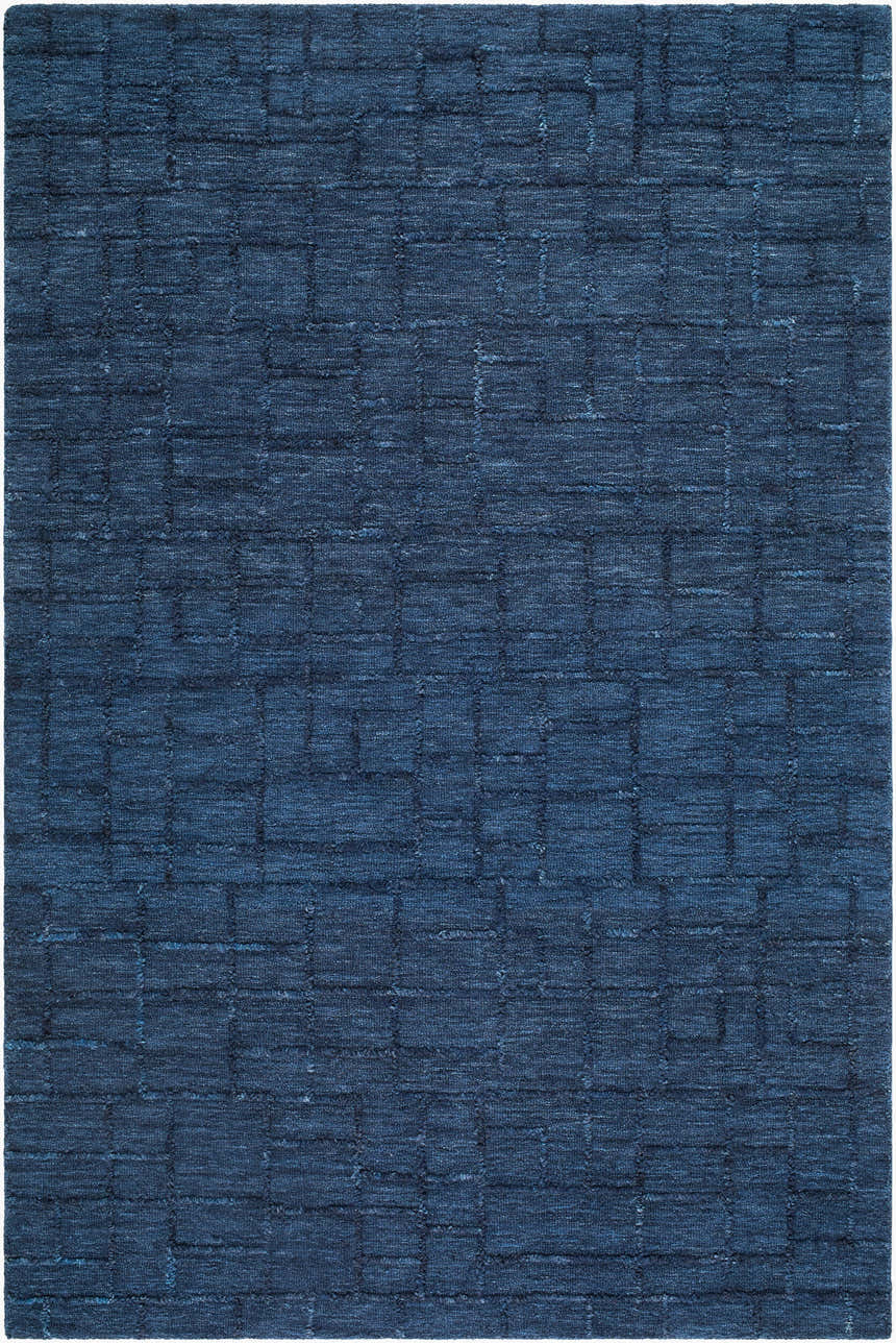 Close-up of the Carastelec Area Rug. Hand-tufted 100% wool rug in blue, denim, and midnight blue with a contemporary block pattern. Design-Rectangle-576