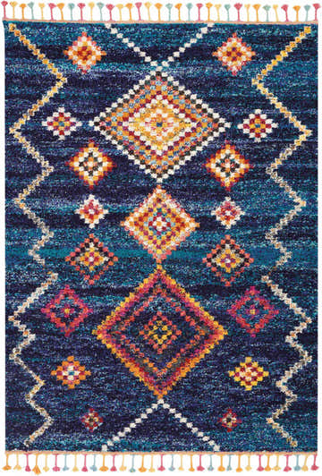 Close-up of the Nourison Nomad Navy Tribal Indoor Area Rug, featuring diamond patterns and colorful tassels.