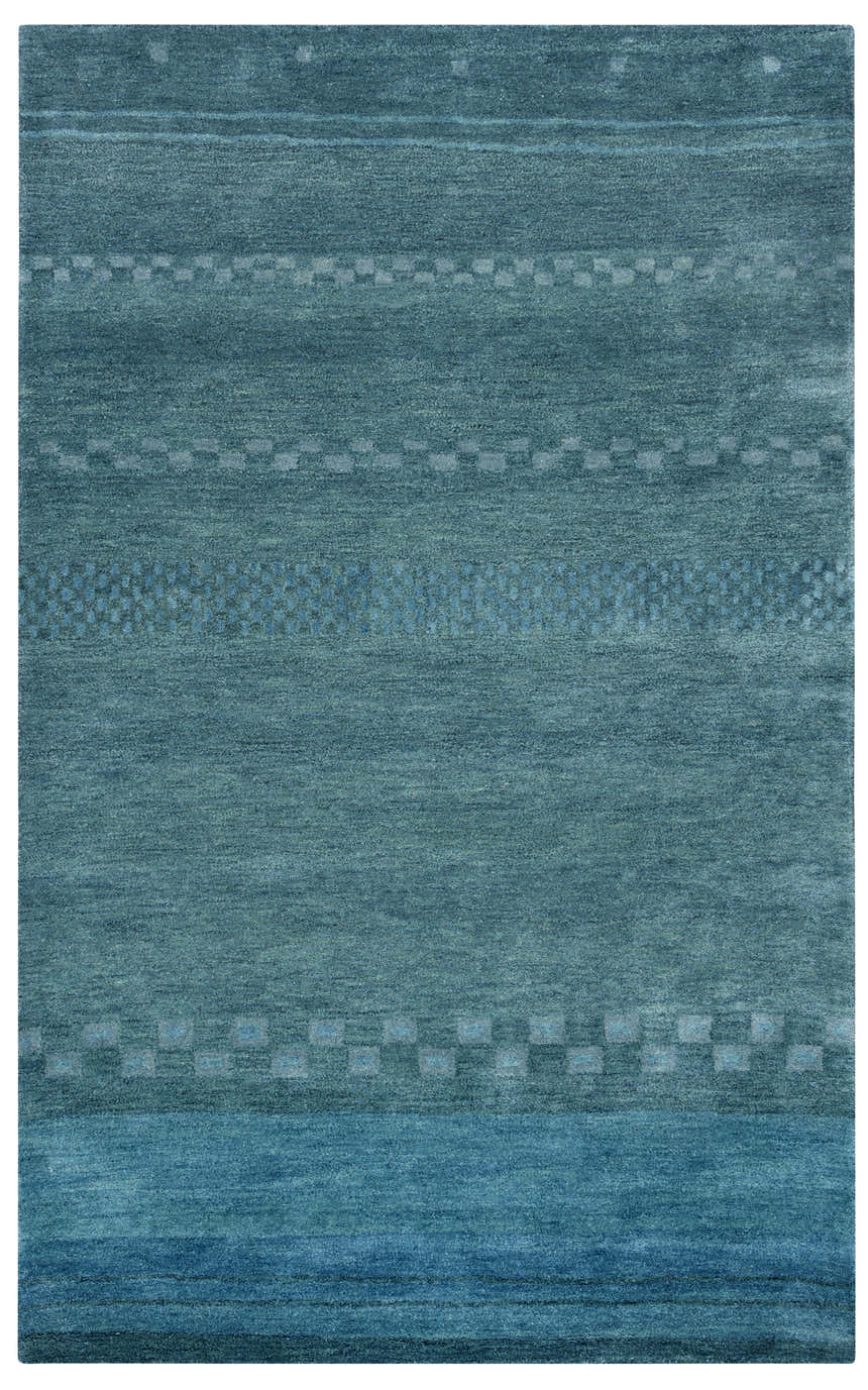 Close-up of the hand-tufted Rizzy MV3161 area rug. Features blue hues and a subtle farmhouse-style geometric pattern. Design-Rectangle