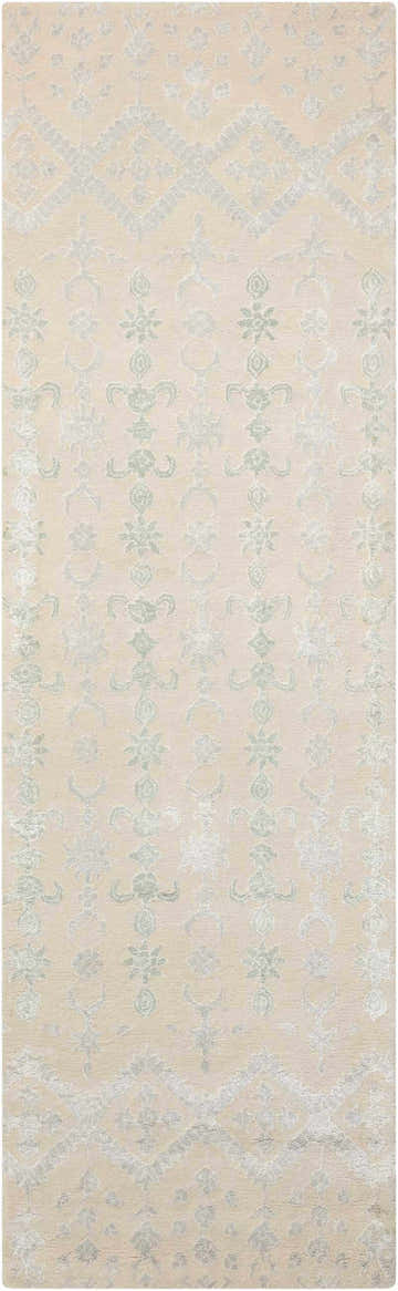 Close-up of Nourison Symphony Ivory rug with a delicate, light blue floral and geometric pattern. Wool and luxcelle texture.