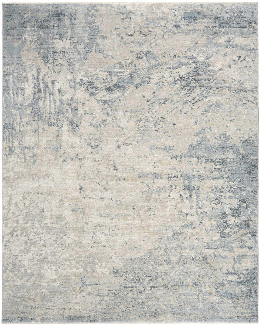 Close-up of the Nourison Envy Blue Silver rug. Abstract design with high pile texture, blue, silver, and neutral tones.