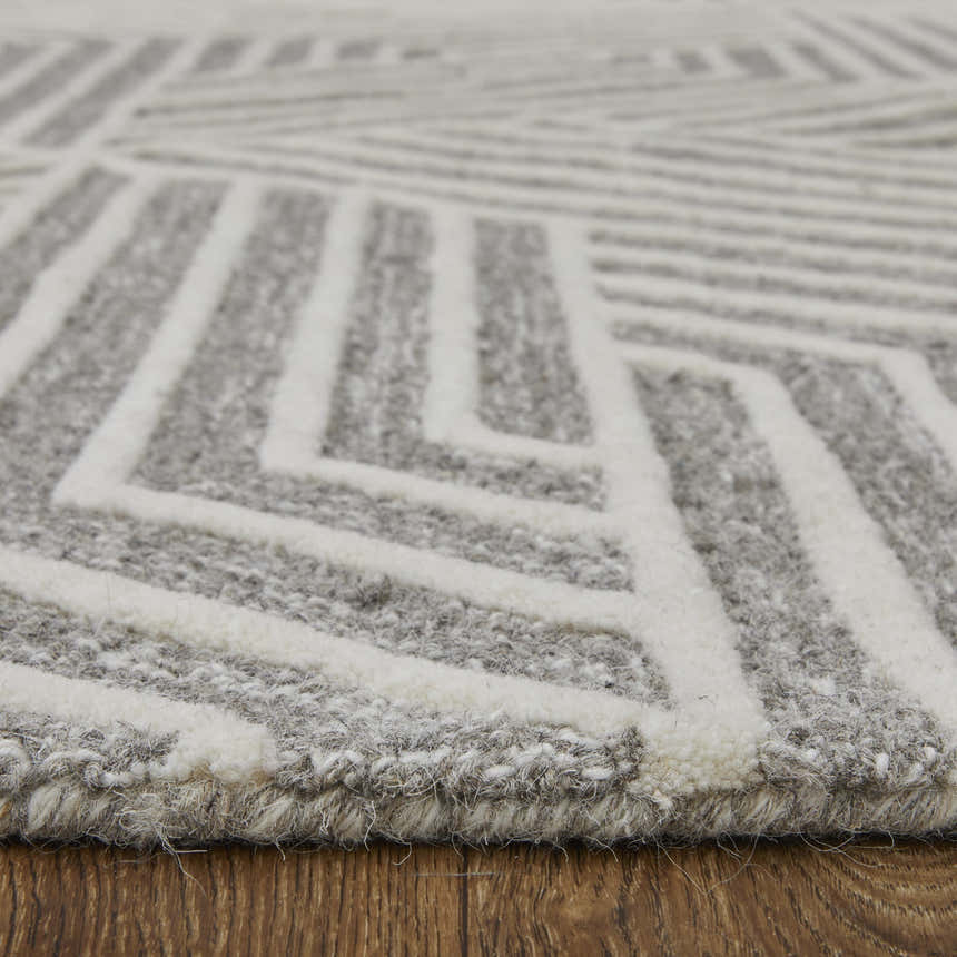 Close-up of Feizy Lytton Modern Geometric rug; gray and ivory wool with hand-tufted geometric pattern and texture. Pile