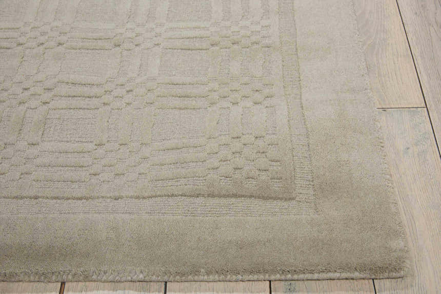 Close up of the grey Nourison Westport rug showing its wool texture and subtle geometric pattern.