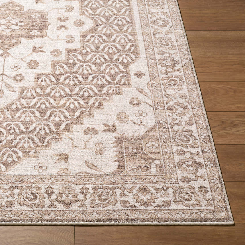 Close-up of Lokai Dark Brown Medallion rug showing traditional brown floral pattern and border on wood floor. Front