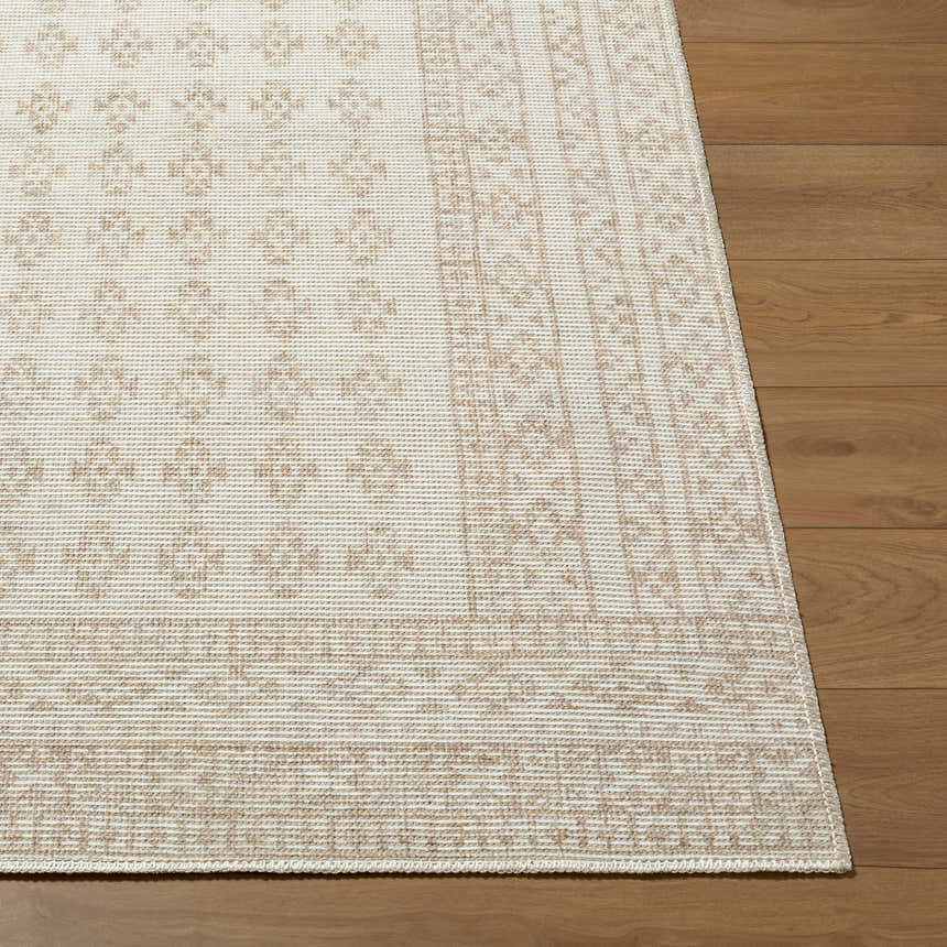 Close up of the Daichi Area Rug showing off-white and taupe pattern on wood floor. Front