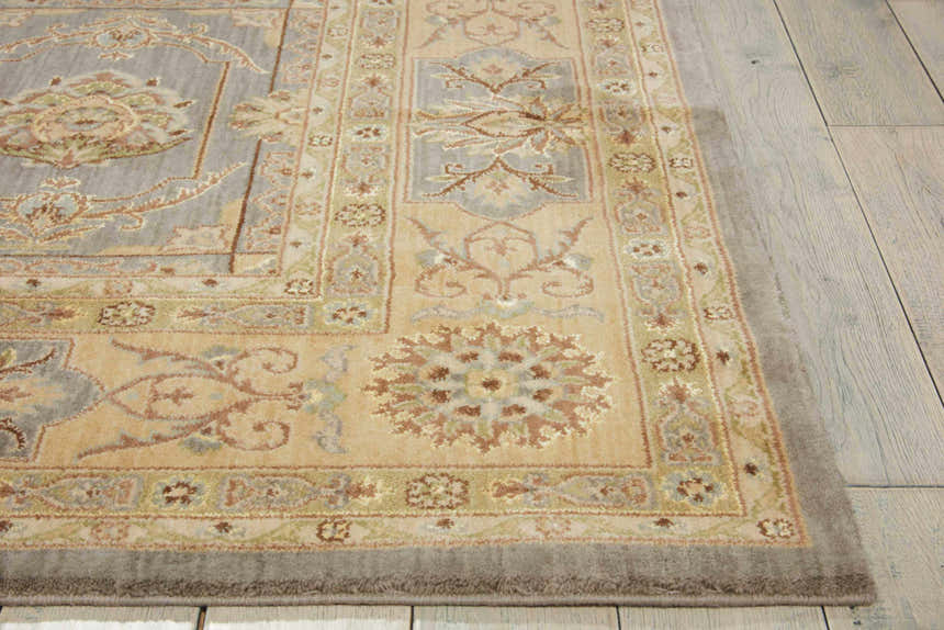 Close-up of the slate Nourison Persian Empire rug. Persian style rug in taupe with floral pattern and border detail.