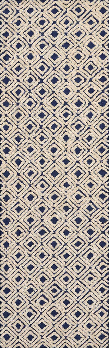 Close-up of Nourison Deco Mod Navy Ivory rug. Diamond pattern, mid-century modern style, handmade texture.