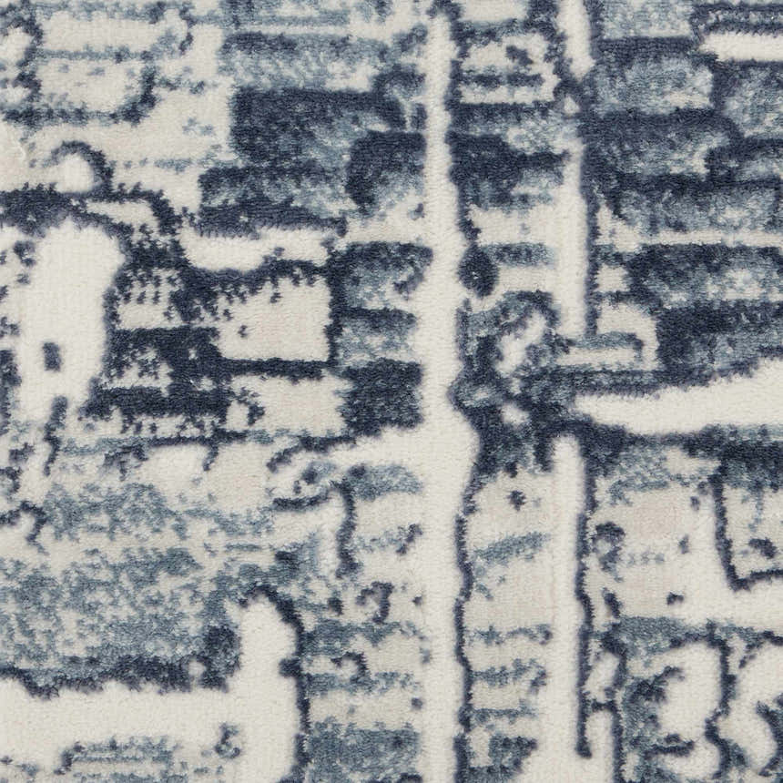 Close-up of the Nourison Urban Chic Ivory rug, showing the chestnut abstract pattern and soft texture.