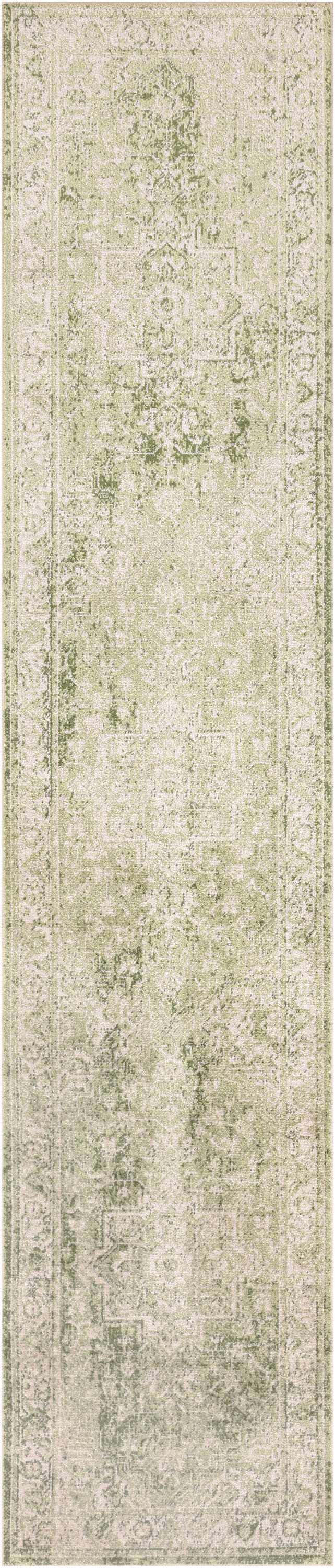 Close-up of the Nourison Astra Ivory Green Vintage Rug, showcasing its distressed pattern and soft texture.