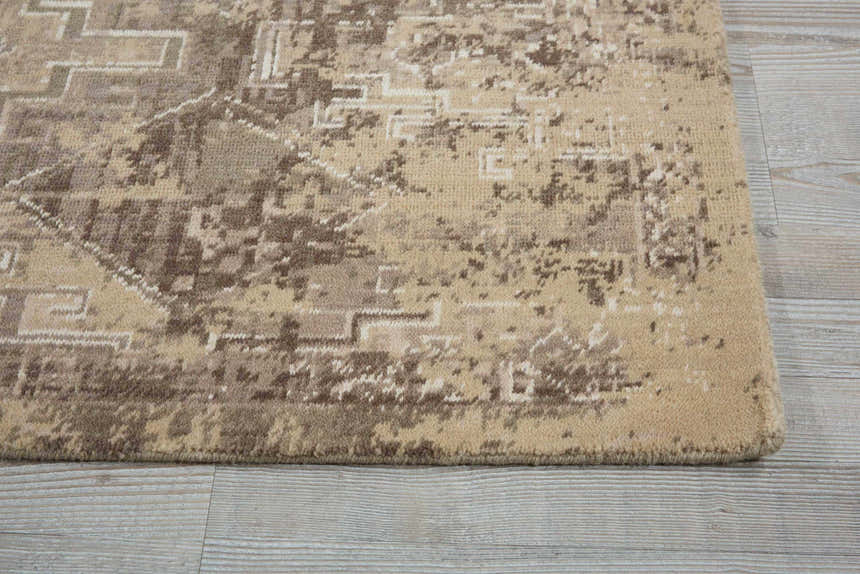 Close up of the Nourison Silk Elements Mushroom Persian rug, showing the wool texture and subtle geometric pattern.