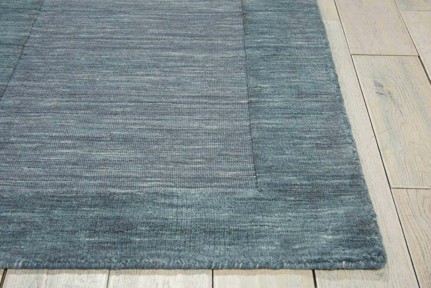Close-up of the handmade Barclay Butera Ripple Spa runner rug showing wool texture and spa blue color.