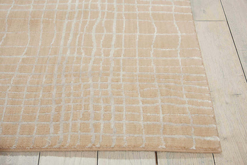 Close up of the Nourison Nepal Manilla Vintage Indoor Area Rug showing its grid pattern and soft manilla color.