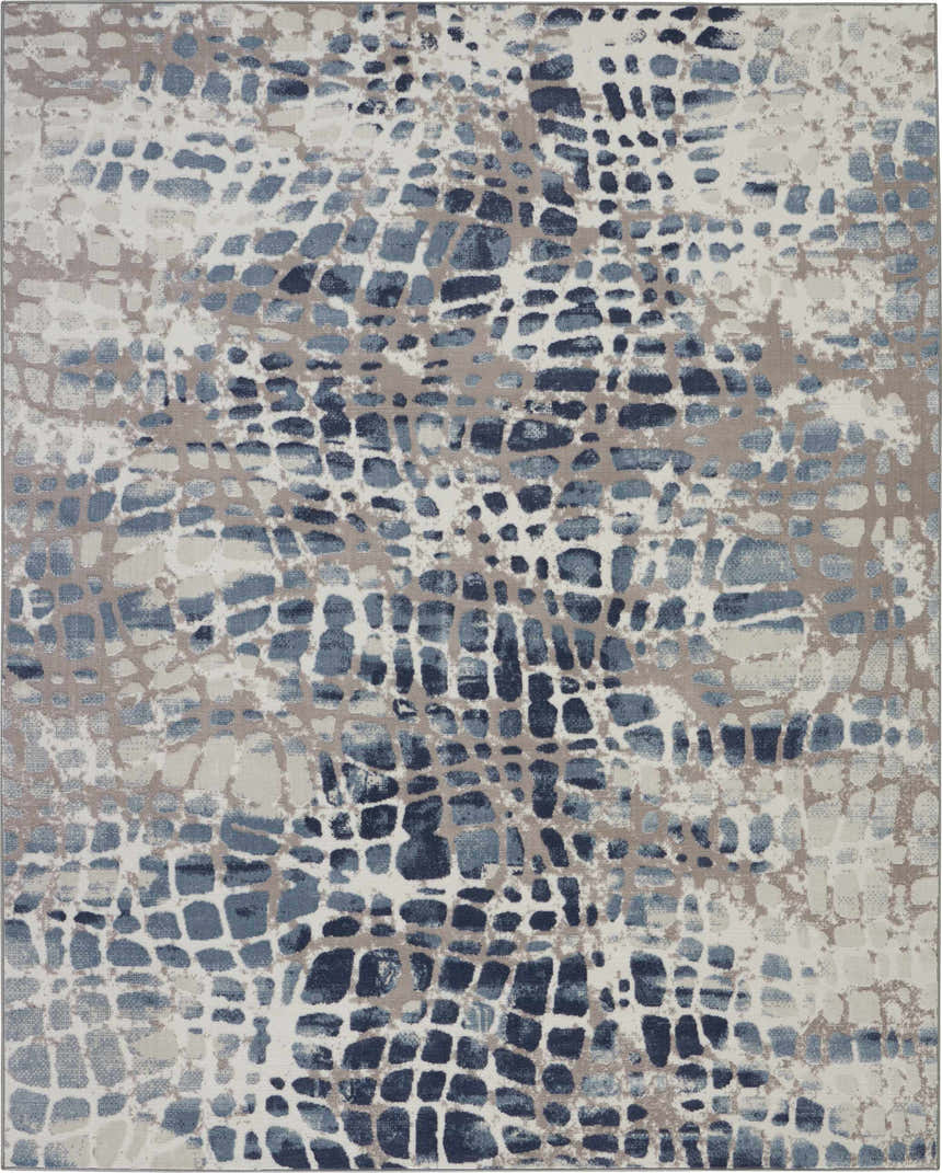 Close-up of Nourison Urban Decor Ivory/Grey rug. Abstract pattern in ivory, grey, and blue. Mid-Century Modern style.