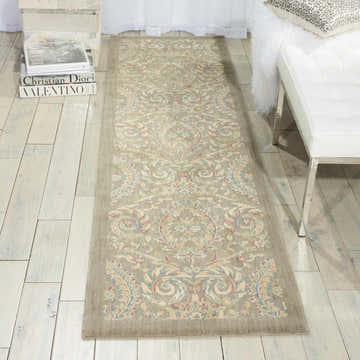 Entryway scene with Barclay Butera Hinsdale Feather rug, white bench, and light wood floors. Elegant, neutral tones.