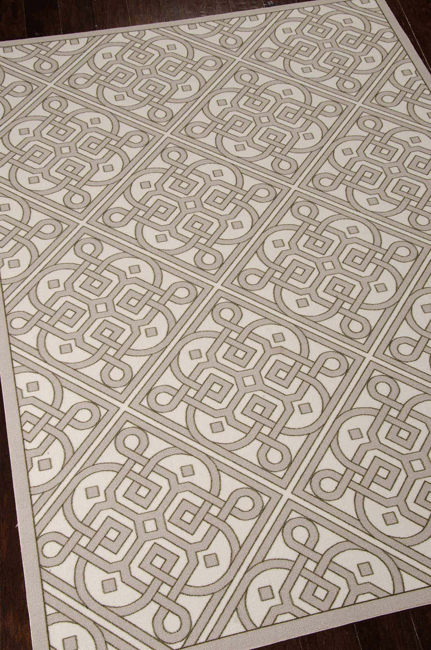 Close-up of Waverly Sun N' Shade Stone Modern Area Rug. Sandstone color, geometric pattern, and machine-made texture.