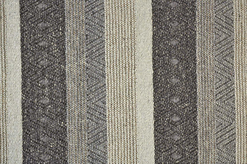 Close-up of the hand woven Feizy Berkeley Gray/Taupe/Tan Area Rug featuring a striped design and wool texture. Texture