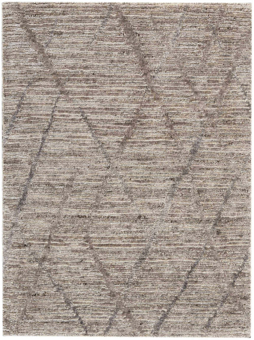 Close-up of the handmade Nourison OCEAN Ash area rug. Modern design with ash tones and subtle geometric pattern.