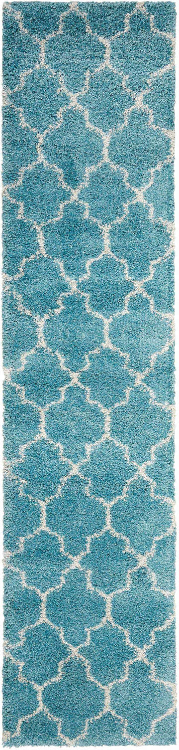 Close-up of the Nourison Amore Aqua Moroccan shag rug, featuring a geometric trellis pattern in aqua and white.