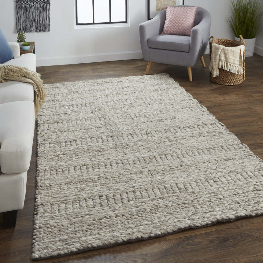 Living room scene with a Feizy Berkeley ivory/gray/tan rug, white sofa, gray chair, and dark wood floors. Roomscene-Rectangle