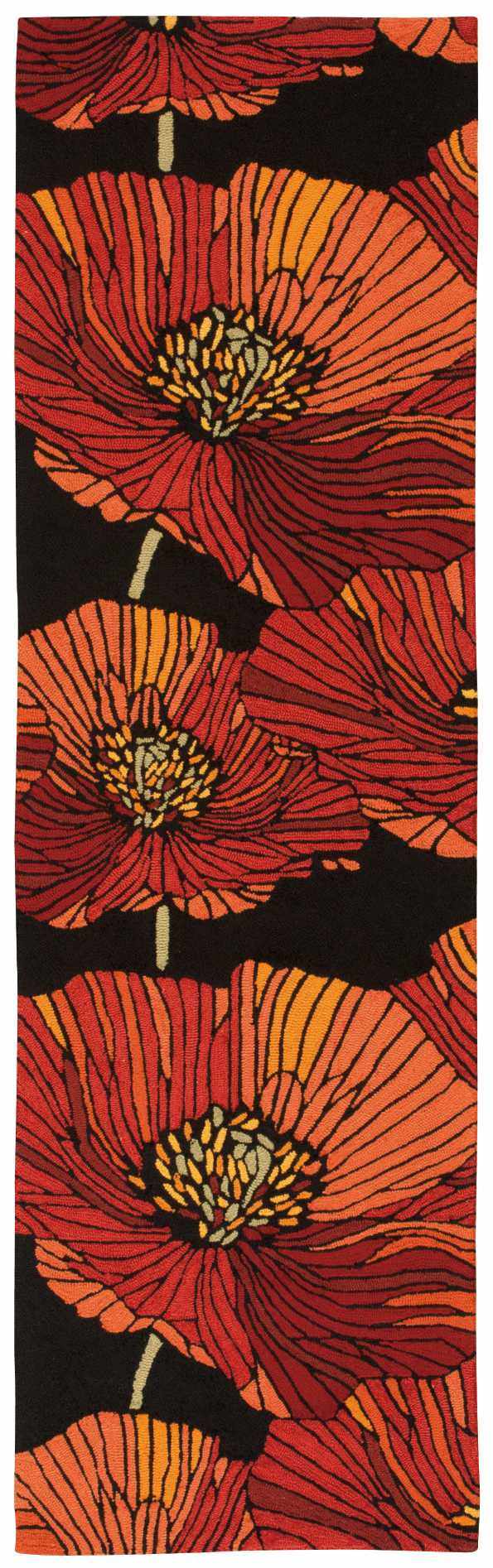 Close-up of the Nourison Fantasy Black rug featuring a bold floral pattern in shades of red, orange, and yellow.