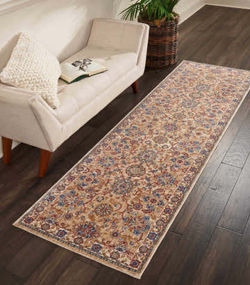 Entryway with a Nourison Lagos Natural Persian runner rug, brick red and blue floral pattern on dark wood floor.