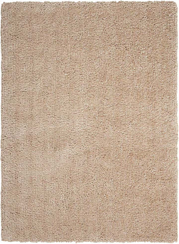 Close-up of the Calvin Klein Puli Seed Shag rug. The handmade rug has a dense, soft pile in a neutral seed color.